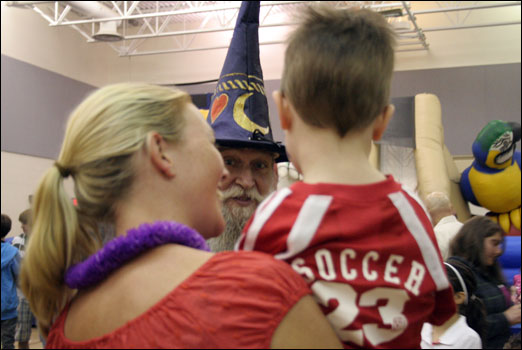 A wizard entertains a child at the Bedford South Spring Fair on Saturday. Photo: Susan Mills