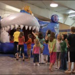 Kids wait to enter a bouncy shark during a charity event in support of Dyrick McDermott's family at the LeBrun Centre on Saturday. The Bedford resident died unexpectedly on April 17, 2009, leaving behind a wife and two young children.