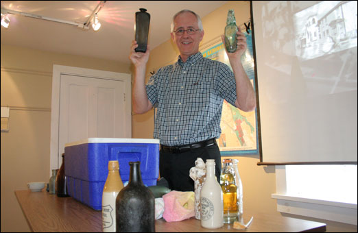 Author, historian, scuba diver Bob Chaulk shows some of the artifacts he has found in the Halifax Harbour.