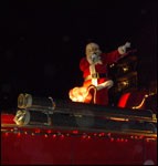 Santa waves to a crowd of kids, big and small, during the 2007 Light Up Bedford Parade.