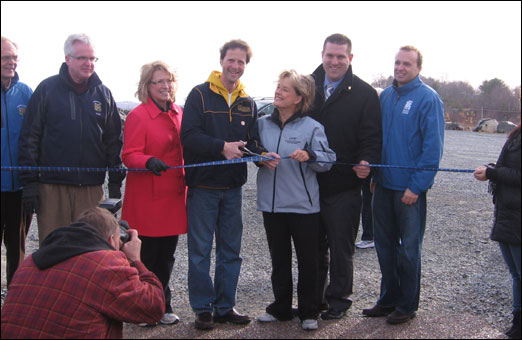 Bedford Councillor Tim Outhit, MLA for Bedford-Birch Cove Kelly Regan, Mayor Peter Kelly, Chamber of Commerce President Valerie Payn, MLA for Hammonds Plains-Upper Sackville Mat Whynott and President and CEO of the Waterfront Development Corporation Colin MacLean get ready to cut the ribbon.