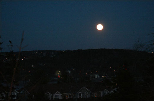 A full moon lights up Bedford, Nova Scotia on December 2, 2009.