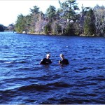 Two youths from the neighbourhood enjoy an evening dip in Papermill Lake on Friday evening.