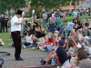 A magician entertains the crowd.
