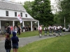 The Pipes and Drums of Clan Farquharson perform in front of the Scott Manor House.