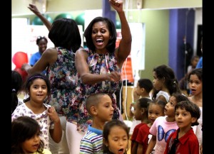 So what’s a feminist like me doing talking about Michelle Obama’s red silk sheath?