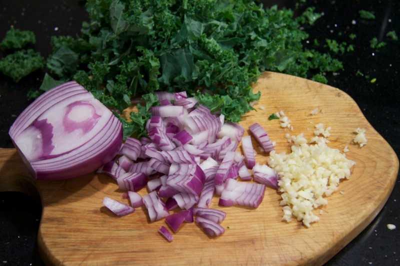 chopped kale, onions & garlic by The Culinary Chase