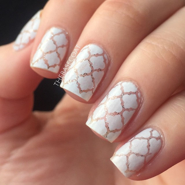 White Moroccan Print created with Whatsupnails Moroccan Stencils, Zoya Purity, and Orly Tiara. I started by painting my nail with the silver glitter, then applied the stencils. I then sponged the white polish over the stencils & added a topcoat.